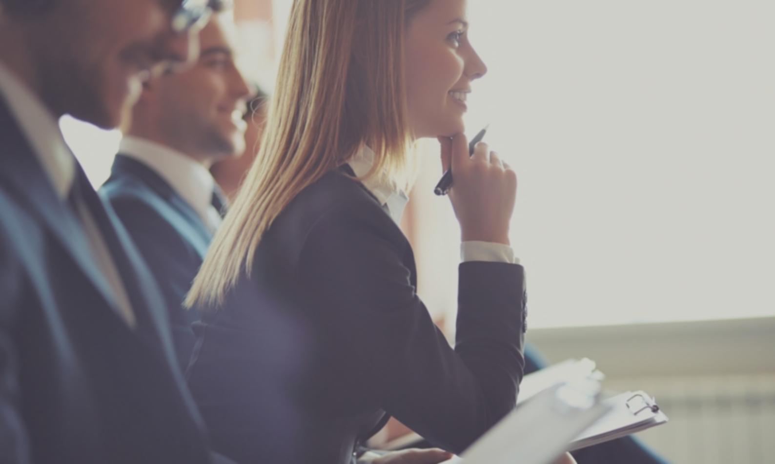 Small business owner confidently reviewing improved cash flow projections on computer screen